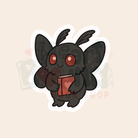 Mothman Holding Book
