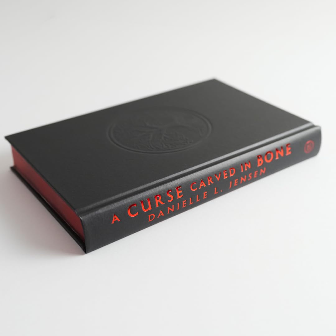 A CURSE CARVED IN BONE by DANIELLE L. JENSEN