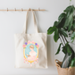 She Lives Between Pages Canvas Tote Bag